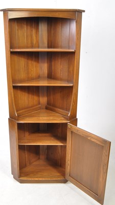 Lot 802 - ERCOL FURNITURE - 20TH CENTURY BEECH & ELM WOOD CORNER CUPBOARD