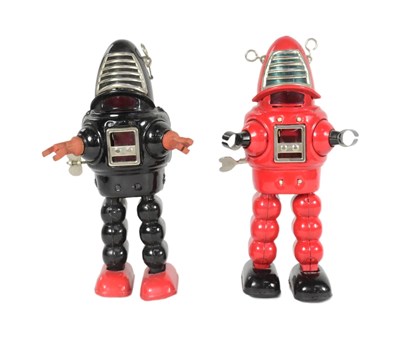 Lot 582 - TINPLATE TOYS - X2 FORBIDDEN PLANET WIND-UP ROBOTS