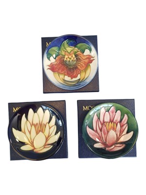 Lot 122 - MOORCROFT - THREE LATE 20TH / 21ST CENTURY POTTERY PIN DISHES