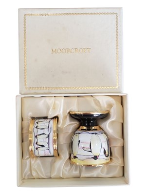 Lot 150 - MOORCROFT - 2000 PENGUIN FAMILY ENAMEL EGG UP AND NAKIN RING SET