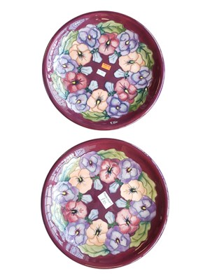 Lot 137 - MOORCROFT - TWO 20TH CENTURY CERAMIC POTTERY PANSY PATTERN PLATES