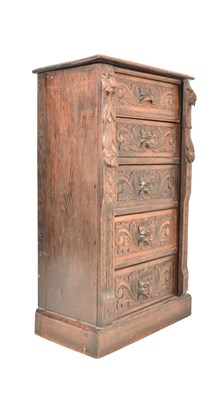 Lot 451 - 19TH CENTURY VICTORIAN CARVED OAK WELLINGTON CHEST WITH GREEN MAN EMBELLISHMENTS