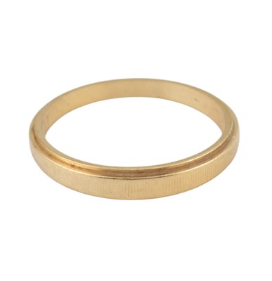 Lot 254 - A 14ct gold tapered band ring. The ring with...