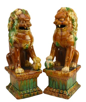 Lot 113 - PAIR OF SANCAI GLAZED FU DOGS / GUARDIAN LIONS 三彩狮子一对