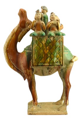 Lot 154 - CHINESE SANCAI GLAZED FIGURE OF A CAMEL CARRING MUSICIANS 三彩骆驼载乐俑