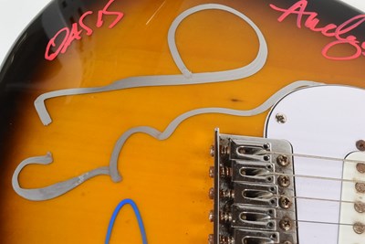 Lot 12 - OASIS (ENGLISH ROCK BAND) - RARE FULL BAND SIGNED GUITAR - AFTAL