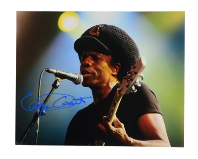 Lot 143 - EDDY GRANT (SINGER) - SIGNED 8X10" ON-STAGE PHOTOGRAPH