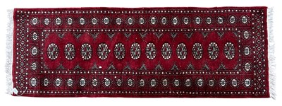 Lot 533 - 20TH CENTURY PERSIAN BOKHARA WOOLLEN CARPET RUNNER RUG