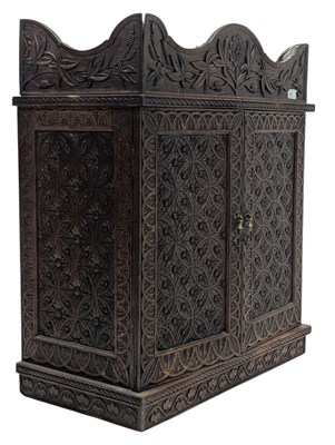 Lot 574 - ANGLO-INDIAN 19TH CENTURY CARVED OAK TWIN DOOR WALL CABINET