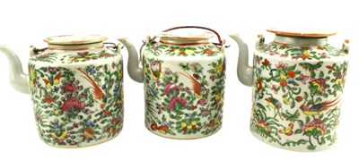 Lot 176 - THREE QING DYNASTY CANTON FAMILLE ROSE TEAPOTS 清 广彩花鸟纹茶壶三个