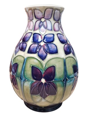 Lot 26 - MOORCROFT - 1990S VIOLET PATTERNED POTTERY VASE
