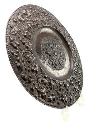 Lot 130 - BELIEVED JOHN PEARSON, NEWLYN SCHOOL, REPOUSSE COPPER FLORAL CHARGER
