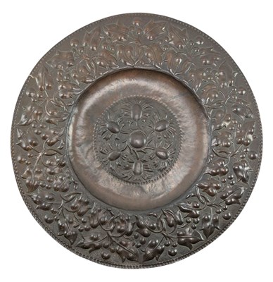 Lot 130 - BELIEVED JOHN PEARSON, NEWLYN SCHOOL, REPOUSSE COPPER FLORAL CHARGER