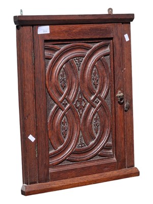 Lot 984 - EARLY 20TH CENTURY CARVED OAK CORNER CABINET