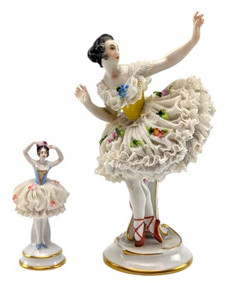 Lot 135 - TWO GERMAN VOLKSTEDT LACE PORCELAIN BALLERINA FIGURINES WITH FLOWER ENCRUSTED SKIRTS