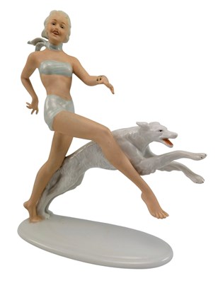 Lot 154 - SCHAUBACH KUNST - ART DECO PORCELAIN CABINET FIGURINE OF A GIRL WITH A DOG