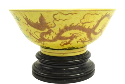 Lot 11 - YELLOW GROUND INCISED ENAMELED BOWL JIAJING MARK 嘉靖款黄地暗刻海水龙纹碗