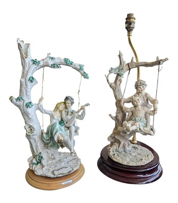 Lot 337 - CAPODIMONTE - TWO LATE 20TH CENTURY RESIN SWING SCULPTURES