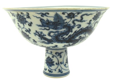 Lot 55 - CHINESE BLUE & WHITE 'DRAGON' STEM BOWL, XUANDE MARK 宣德款 龙穿缠枝莲纹高足盌