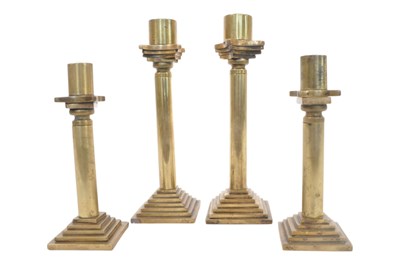 Lot 373 - FOUR EARLY 20TH CENTURY ART DECO STYLE BRASS CANDLESTICK HOLDERS