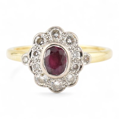 Lot 147 - HALLMARKED 18CT GOLD RUBY & DIAMOND HALO RING