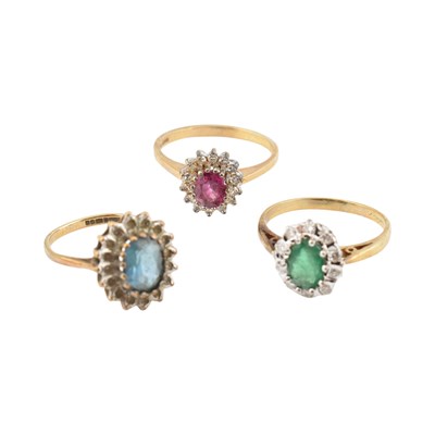 Lot 336 - THREE HALLMARKED 9CT GOLD GEM SET HALO RINGS