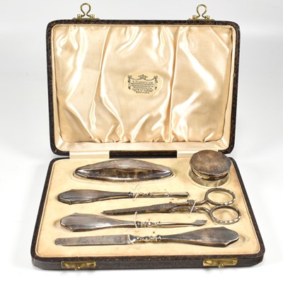 Lot 176 - GEORGE V HALLMARKED SILVER CASED VANITY SET