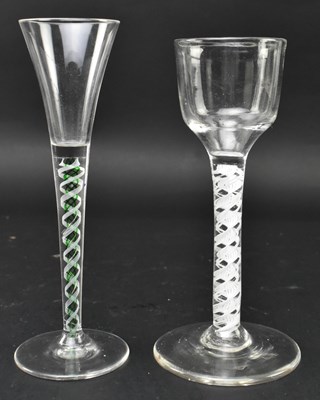 Lot 97 - TWO GEORGE II / III OPAQUE TWIST STEM WINE GLASSES