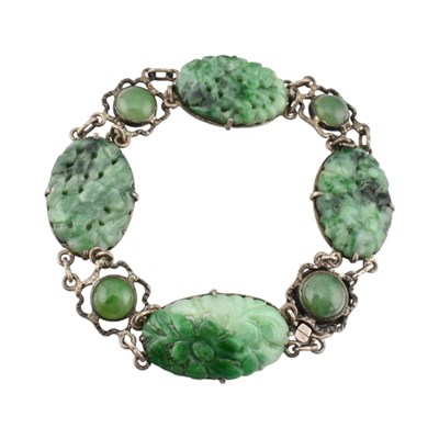 Lot 340 - WHITE METAL CARVED JADE PANEL BRACELET