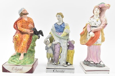 Lot 108 - THREE EARLY 19TH CENTURY STAFFORDSHIRE FIGURINES OF ELIJAH & CHARITY