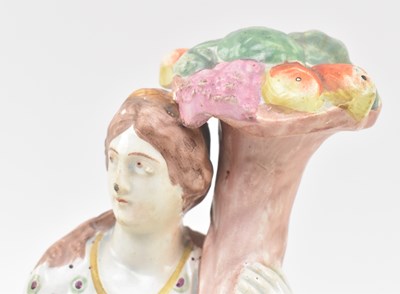 Lot 108 - THREE EARLY 19TH CENTURY STAFFORDSHIRE FIGURINES OF ELIJAH & CHARITY