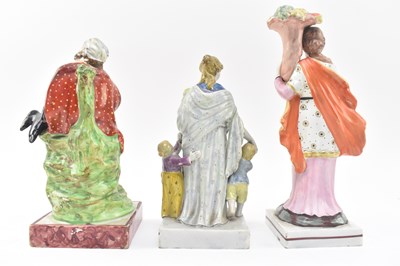 Lot 108 - THREE EARLY 19TH CENTURY STAFFORDSHIRE FIGURINES OF ELIJAH & CHARITY
