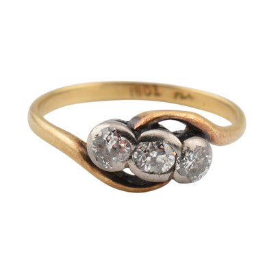Lot 329 - An 18ct gold, platinum and diamond three stone...