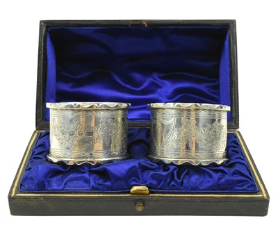 Lot 47 - CASED PAIR OF VICTORIAN HALLMARKED SILVER NAPKIN RINGS