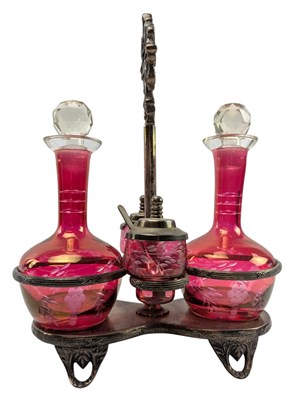 Lot 106 - 19TH CENTURY SILVER-PLATED TWIN CRANBERRY GLASS CRUET SET