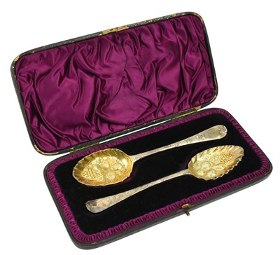 Lot 128 - CASED PAIR OF GEORGE III HALLMARKED SILVER GILT BERRY SPOONS