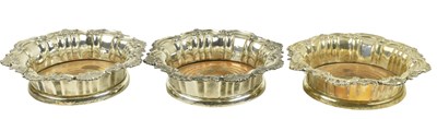 Lot 33 - THREE WILLIAM IV HALLMARKED SILVER & HARDWOOD BASED BOTTLE COASTERS