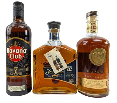 Lot 221 - THREE AGED DARK RUM BOTTLES, FLOR DE CANA, BACARDI GRAN RESERVA & HAVAN CLUB