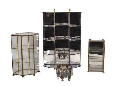 Lot 243 - FOUR 20TH CENTURY VINTAGE BRASS AND GLASS JEWELLERY DISPLAY CABINETS