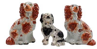 Lot 84 - THREE STAFFORDSHIRE POTTERY 19TH CENTURY SPANIEL DOG FIGURES