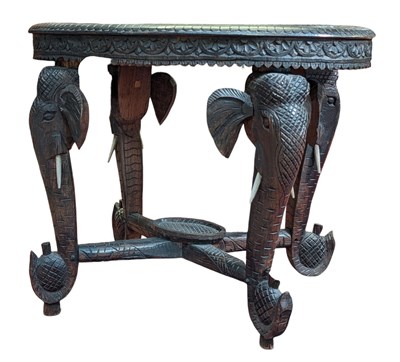 Lot 401 - 19TH CENTURY INDIAN CARVED EBONISED WOOD ELEPHANT TABLE