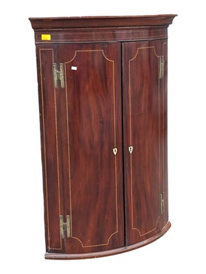 Lot 1039 - GEORGE III 19TH CENTURY MAHOGANY BOW FRONT INLAID CORNER CABINET