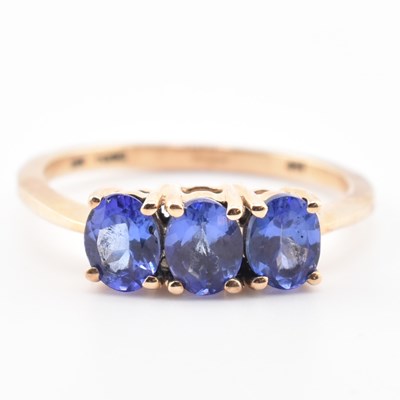 Lot 68 - HALLMARKED 9CT GOLD & TANZANITE THREE STONE RING