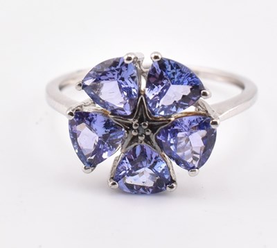 Lot 260 - HALLMARKED 9CT WHITE GOLD TANZANITE & BLUE DIAMOND FLOWER RING