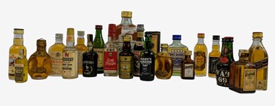Lot 216 - CIRCA 23 VINTAGE & LATER MINIATURE BOTTLES OF WHISKIES AND SPIRITS