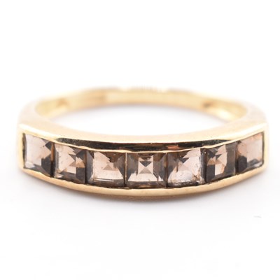 Lot 305 - HALLMARKED 9CT GOLD & SMOKY QUARTZ SEVEN STONE RING