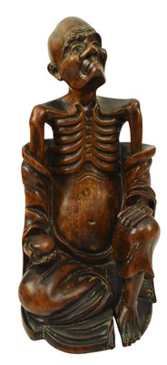 Lot 135 - AN EARLY 20TH CENTURY CHINESE HARDWOOD FIGURE OF A LUOHAN 实木雕罗汉像
