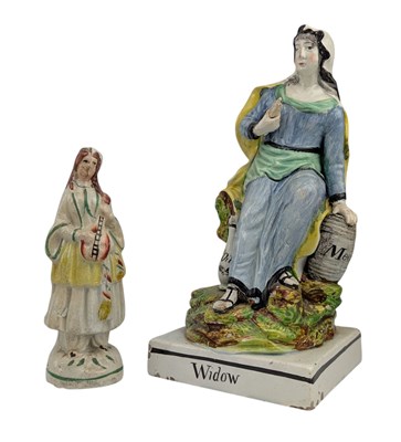 Lot 33 - TWO 19TH CENTURY STAFFORDSHIRE POTTERY FIGURES, TO INCLUDE WIDOW & OTHER