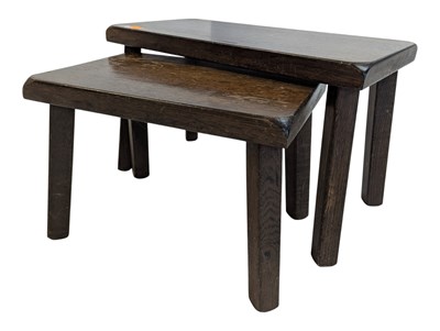 Lot 910 - PAIR OF 20TH CENTURY ARTS & CRAFTS DARK OAK NESTING TABLES