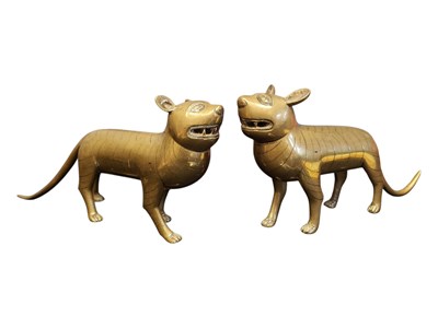 Lot 242 - A PAIR OF 20TH CENTURY INDIAN BRASS TIGER FIGURES